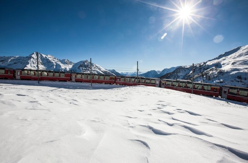 The Bernina Express travelling in winter