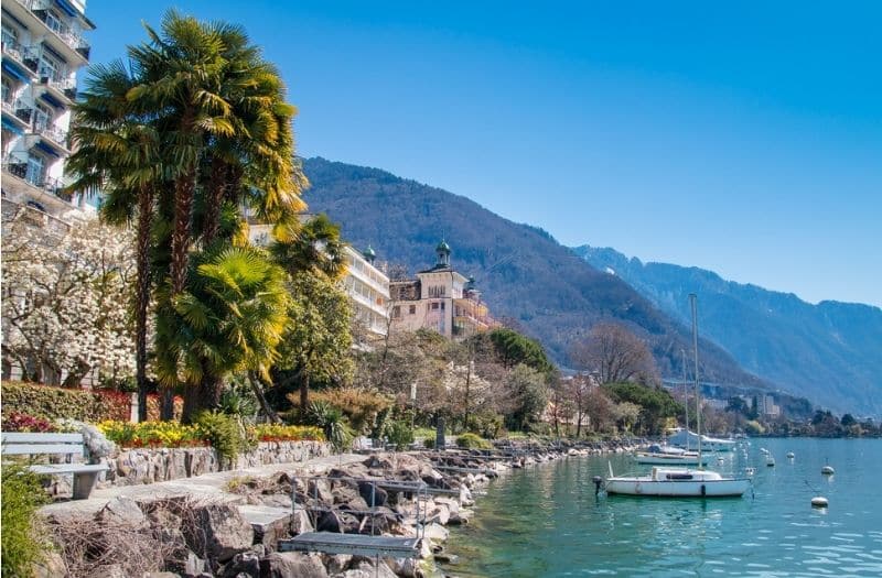 Boats tied up close to the shoreline of Lake Geneva in Montreux