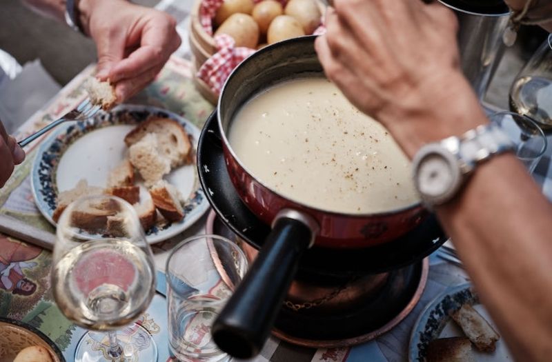 Eating fondue in Gruyeres, Switzerland